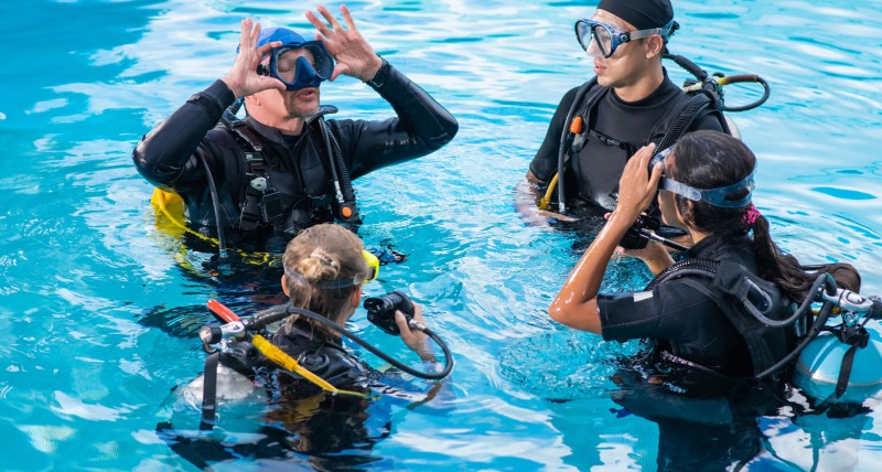 People learn to dive with an instructor at Achi Divers